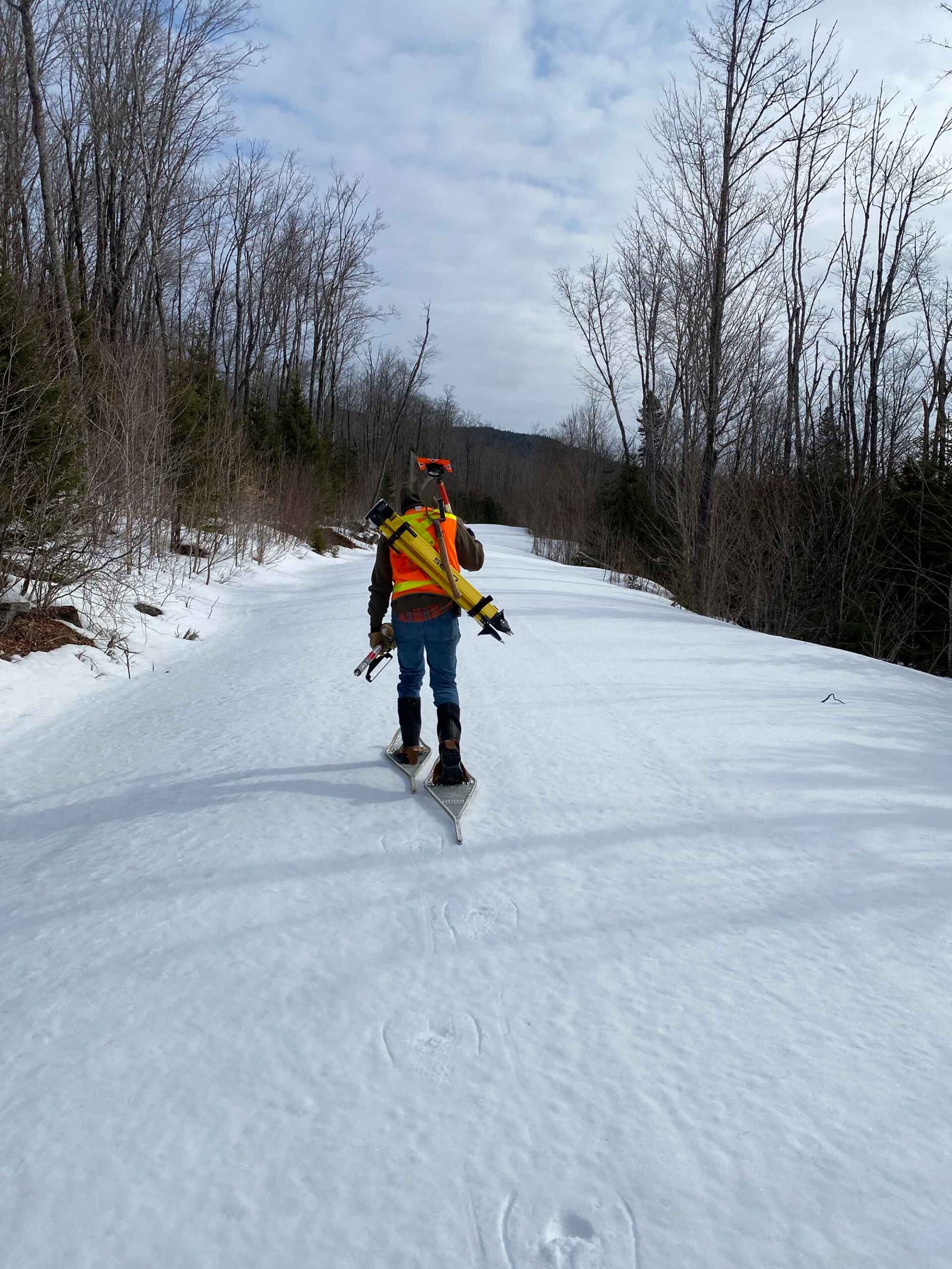 Land-Surveying-Companies-in-Maine-Employee-Snowshoeing